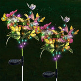 Glowing butterfly solar garden lights at night