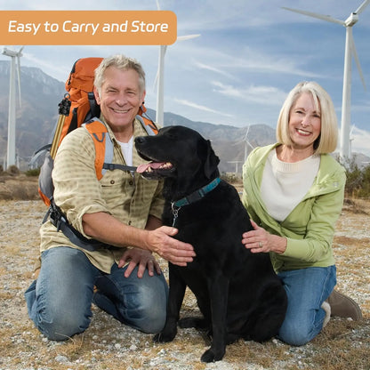 Happy older couple outdoors with black dog promoting AmaCielo Flirt Pole easy to carry and store