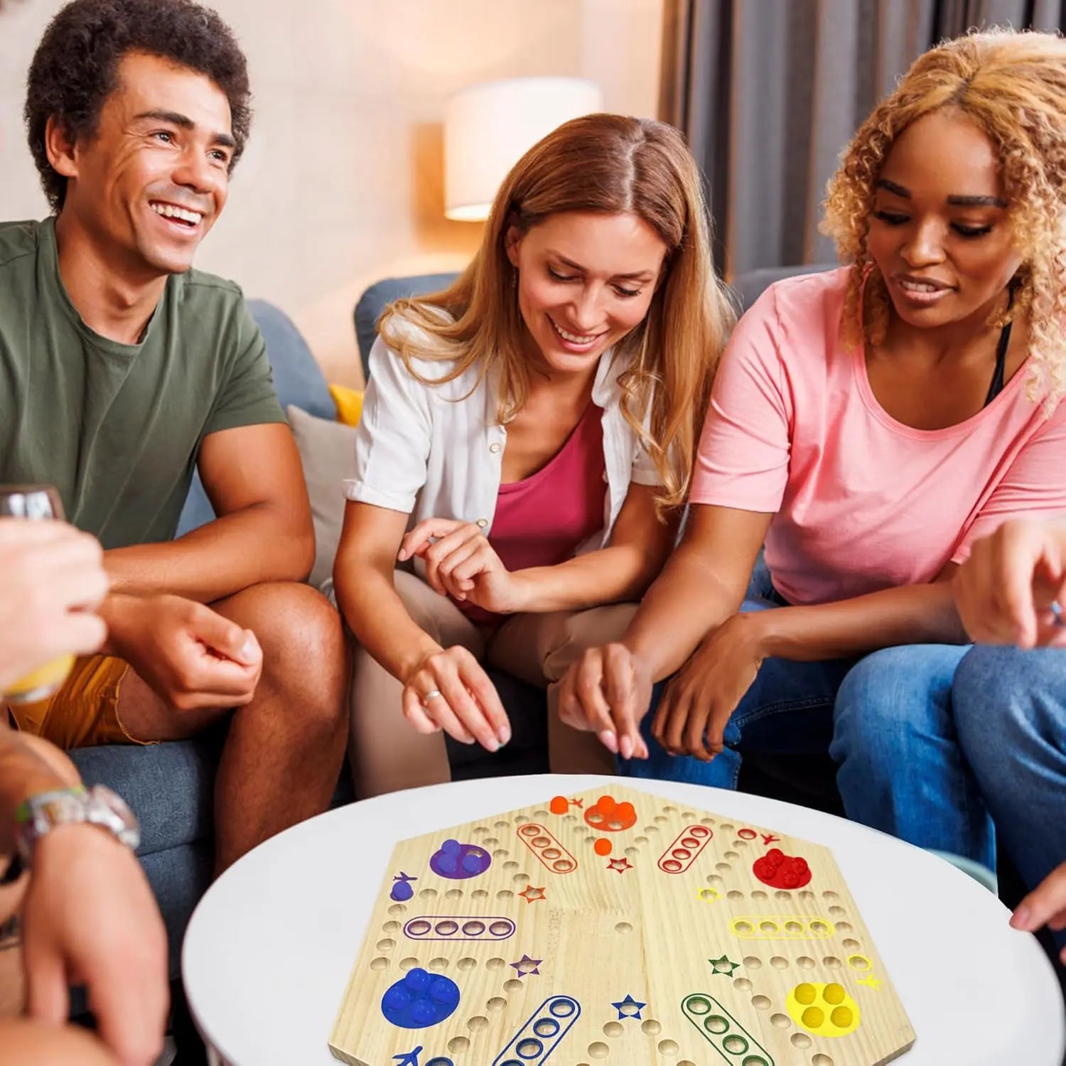 Group of friends playing the MygikAct wooden wall board Wahoo game on a white table